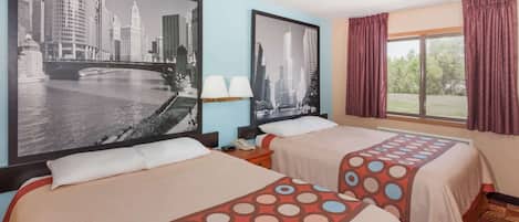 A hotel room with two beds, a cityscape painting on the wall, a window with curtains, and a nightstand with a lamp.