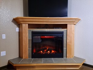 Desk, laptop workspace, blackout drapes, iron/ironing board