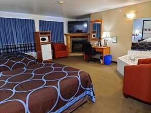 Suite, 2 Queen Beds, Fireplace | Desk, laptop workspace, blackout drapes, iron/ironing board