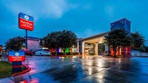 A hotel entrance with a sign reading "SureStay by Best Western." - SureStay Plus by Best Western San Antonio Airport (San Antonio)