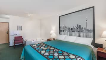 Suite, 1 King Bed, Non Smoking | Desk, laptop workspace, blackout curtains, iron/ironing board