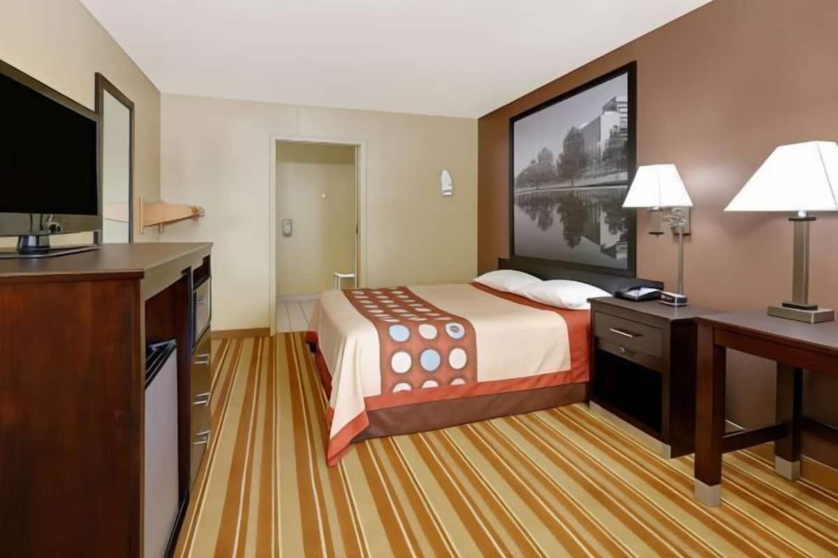 Desk, laptop workspace, blackout curtains, iron/ironing board