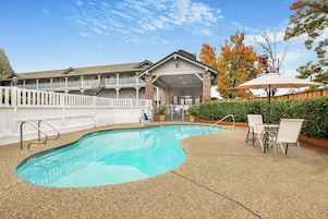 Seasonal outdoor pool, open 9:00 AM to 9:00 PM, pool umbrellas