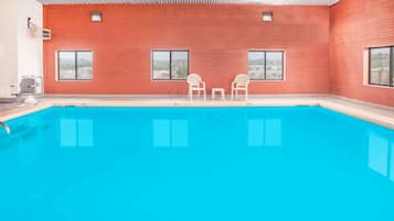 Indoor pool, open 10:00 AM to 10:00 PM, pool loungers