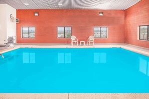 Indoor pool, open 10:00 AM to 10:00 PM, pool loungers