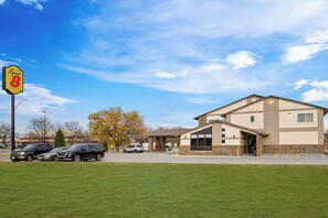 Situated on a grassy area, this motel offers a simple, functional design with a covered entrance.
