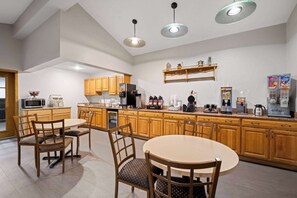 Enjoy cooking in this well-equipped kitchen with a central island, oven, and range.