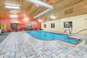 Indoor pool, pool umbrellas, pool loungers