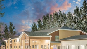 A hotel with a two-story structure, a covered entrance, and a parking area. - Super 8 by Wyndham Webster City IA (Webster City)