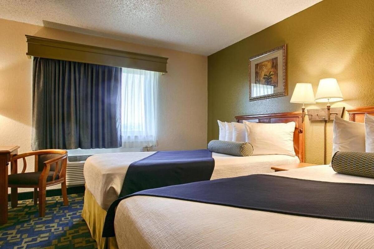 Desk, laptop workspace, iron/ironing board, free cribs/infant beds