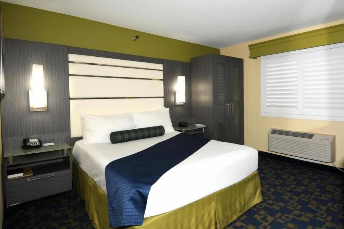 Desk, laptop workspace, iron/ironing board, free cribs/infant beds