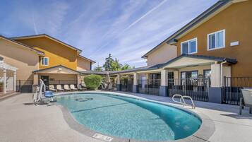 Outdoor pool, open 9:00 AM to 10:00 PM, pool umbrellas, sun loungers