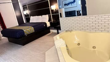 1 King Suite Jacuzzi, Non Smoking | Hypo-allergenic bedding, in-room safe, laptop workspace