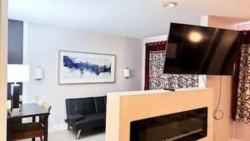 1 King Suite Jacuzzi, Non Smoking | Hypo-allergenic bedding, in-room safe, laptop workspace, blackout drapes