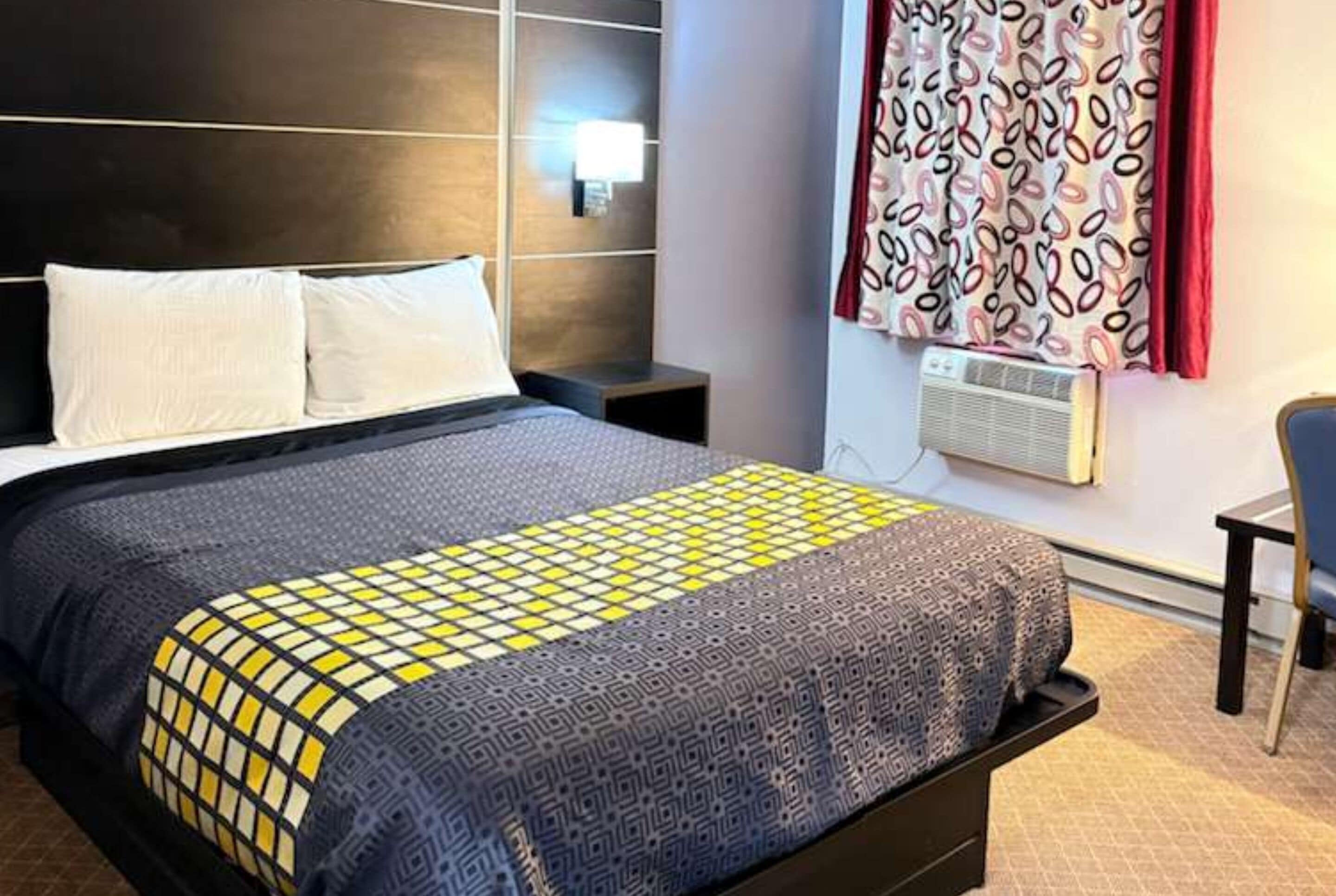 Hypo-allergenic bedding, in-room safe, laptop workspace