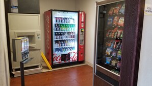 A vending machine area with a Coca-Cola refrigerator and a snack vending machine. - Super 8 by Wyndham St. Cloud (St Cloud)