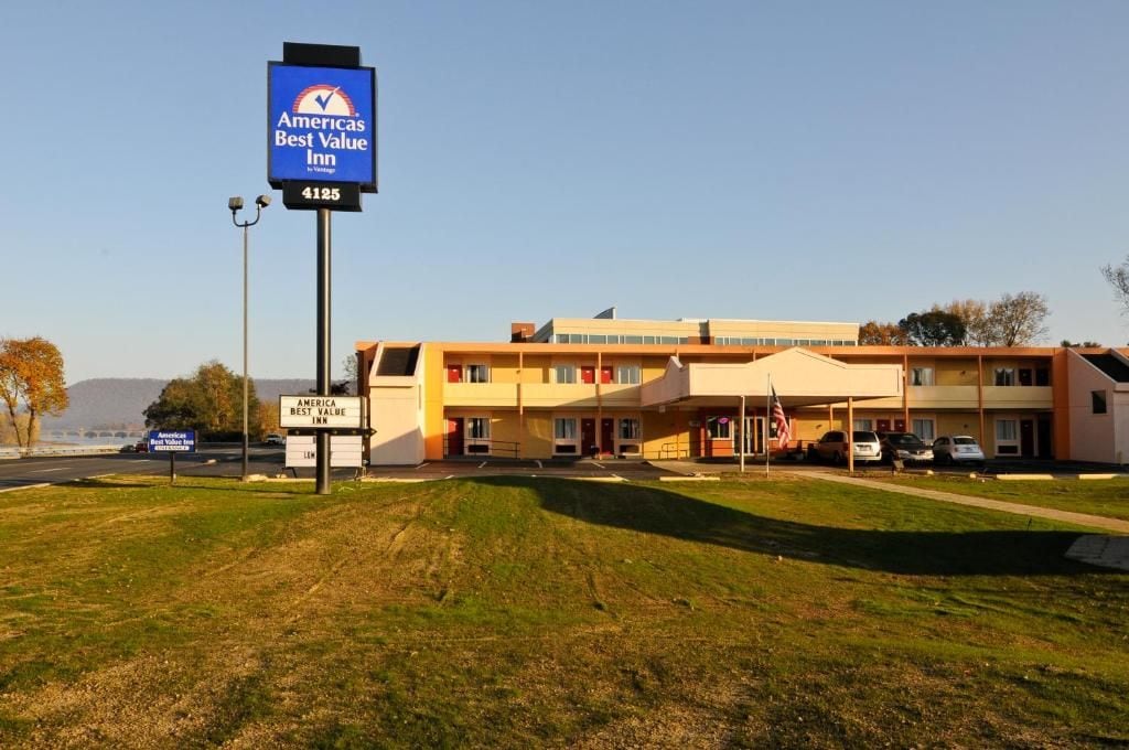 A multi-story motel with a prominent sign for America's Best Value Inn.