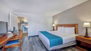 Tabla de planchar con plancha, wifi gratis, despertador y ropa de cama