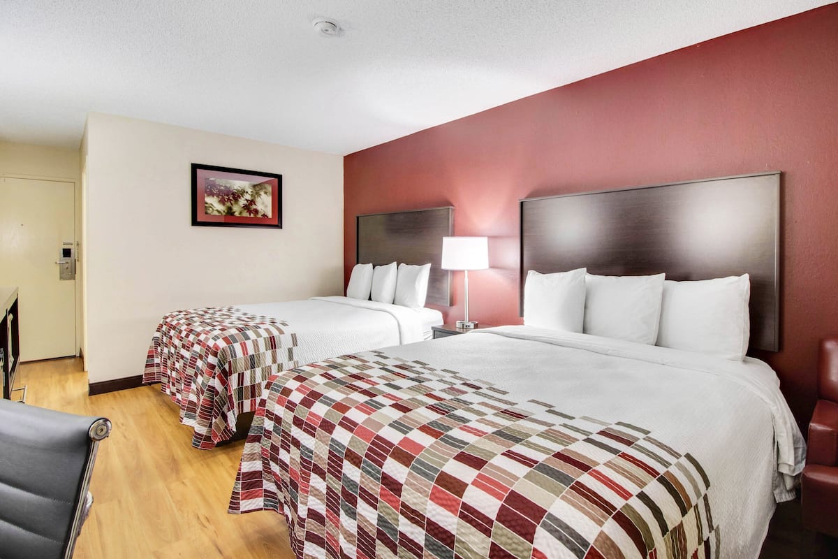 Deluxe Room, 2 Queen Beds, Non Smoking | Desk, blackout drapes, iron/ironing board, free cribs/infant beds