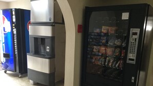 A vending machine with snacks and a water dispenser.