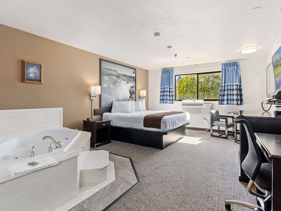 Suite, 1 King Bed, Non Smoking, Jetted Tub (Walk-in Shower) | Iron/ironing board, free cots/infant beds, rollaway beds, free WiFi