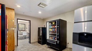 A room with a vending machine, a microwave, and a refrigerator. - SureStay Hotel by Best Western Twin Falls (Twin Falls)