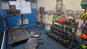A gym with treadmills, weight benches, dumbbells, and exercise balls. - Clarion Pointe Tallahassee-State Capitol (Tallahassee)