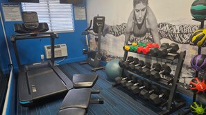A gym with treadmills, weight benches, dumbbells, and exercise balls. - Clarion Pointe Tallahassee-State Capitol (Tallahassee)