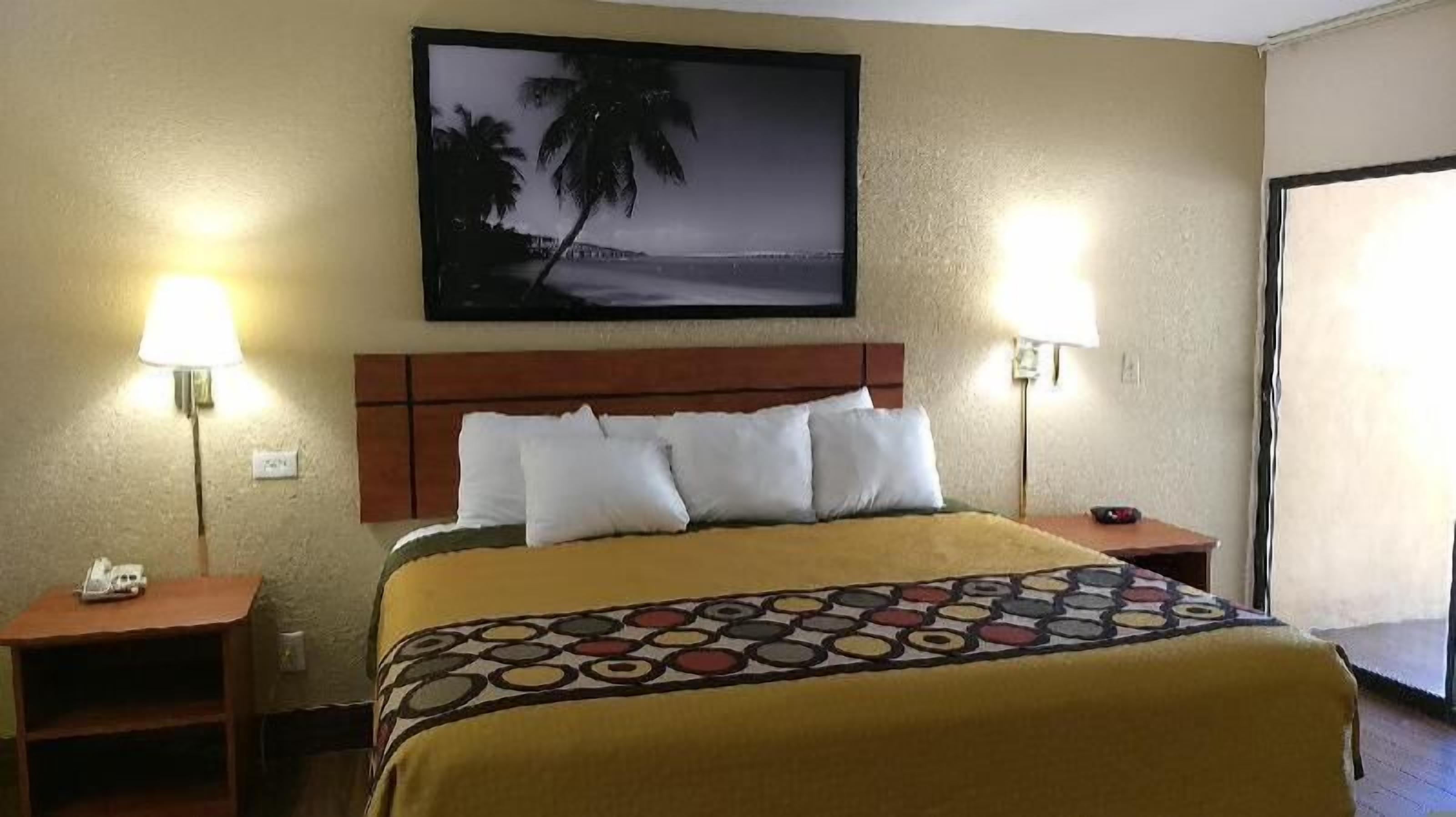 Desk, blackout drapes, iron/ironing board, free cribs/infant beds