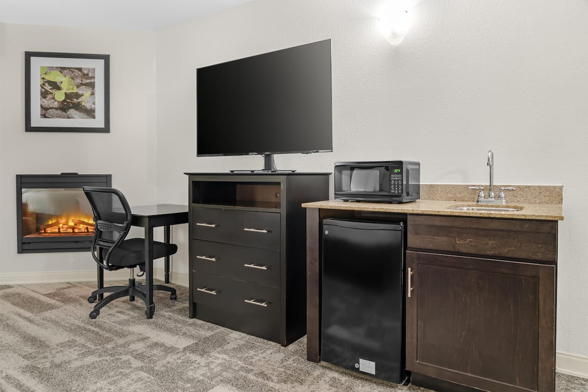 suite, 1 king bed, balcony, pool view (with sofabed) | 1 bedroom, in-room safe, desk, blackout curtains