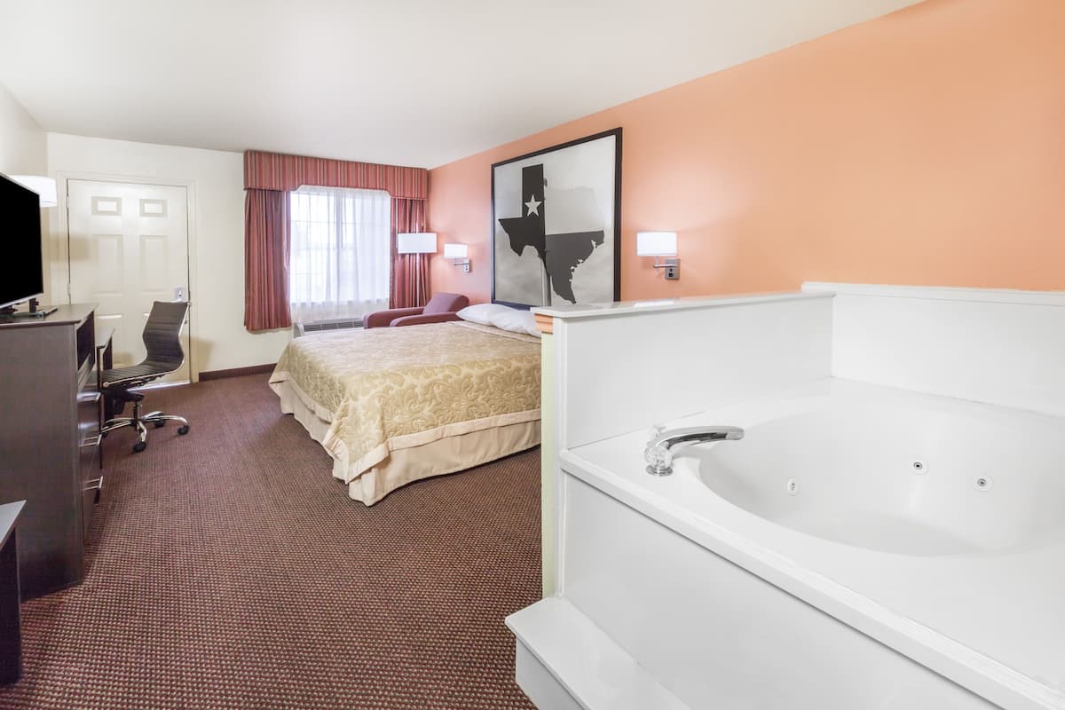 Suite, 1 King Bed, Non Smoking, Jetted Tub | Desk, blackout drapes, free WiFi, bed sheets