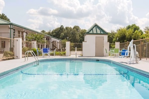 Seasonal outdoor pool, open 9:00 AM to 9:00 PM, pool loungers