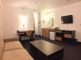 Suite, 1 King Bed, Non Smoking (One Bedroom) | In-room safe, desk, laptop workspace, iron/ironing board