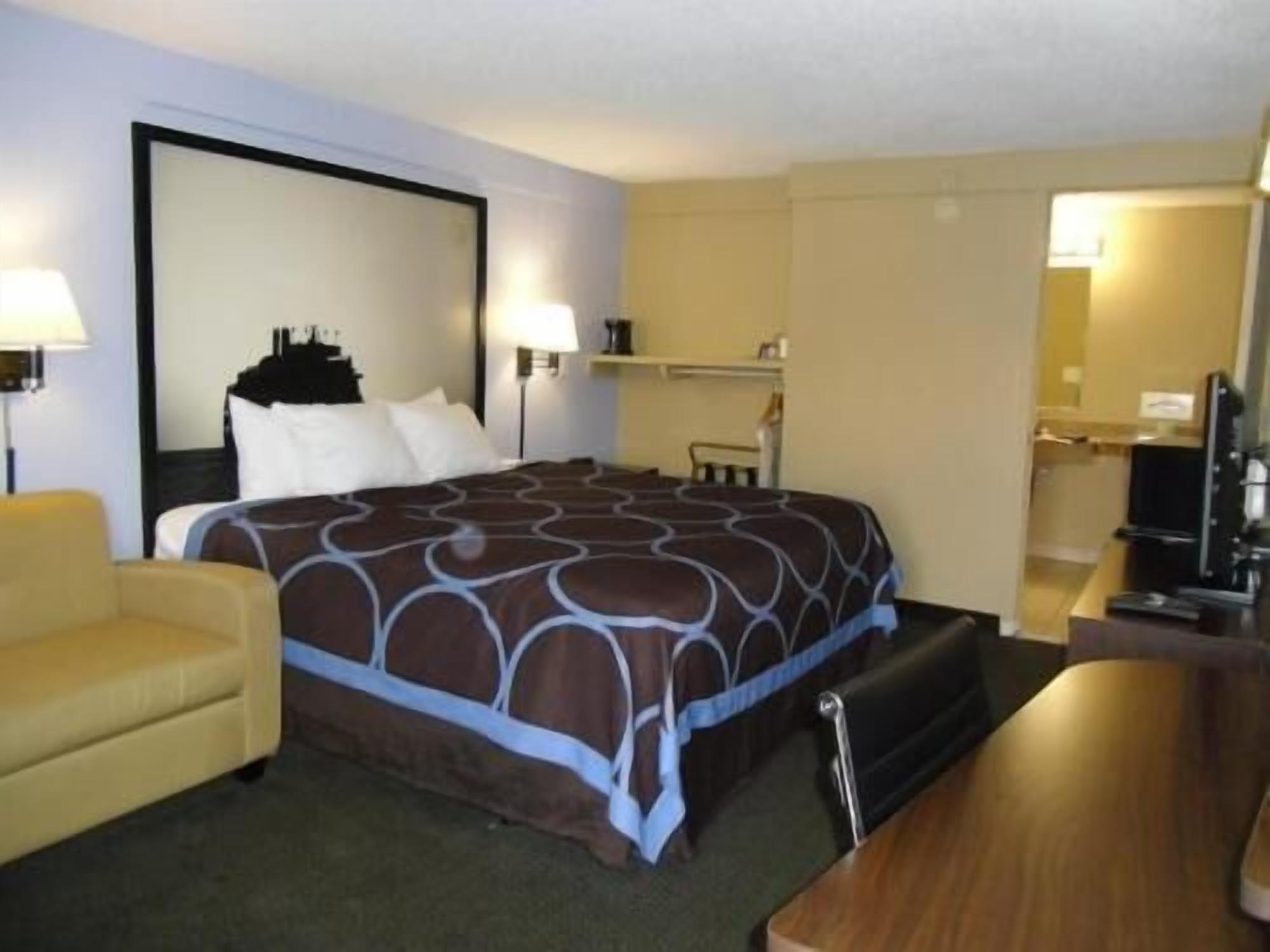 Desk, laptop workspace, blackout curtains, iron/ironing board