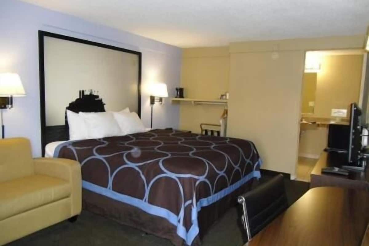 Desk, laptop workspace, blackout curtains, iron/ironing board