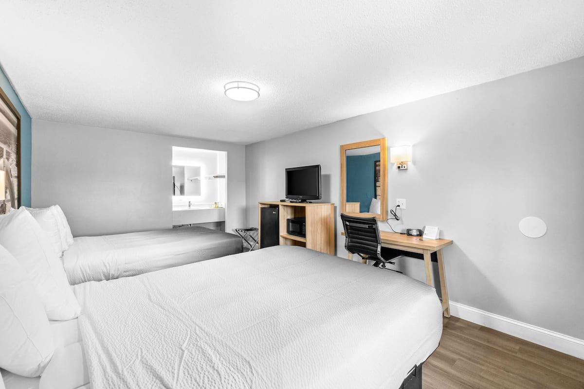 Desk, laptop workspace, blackout drapes, iron/ironing board