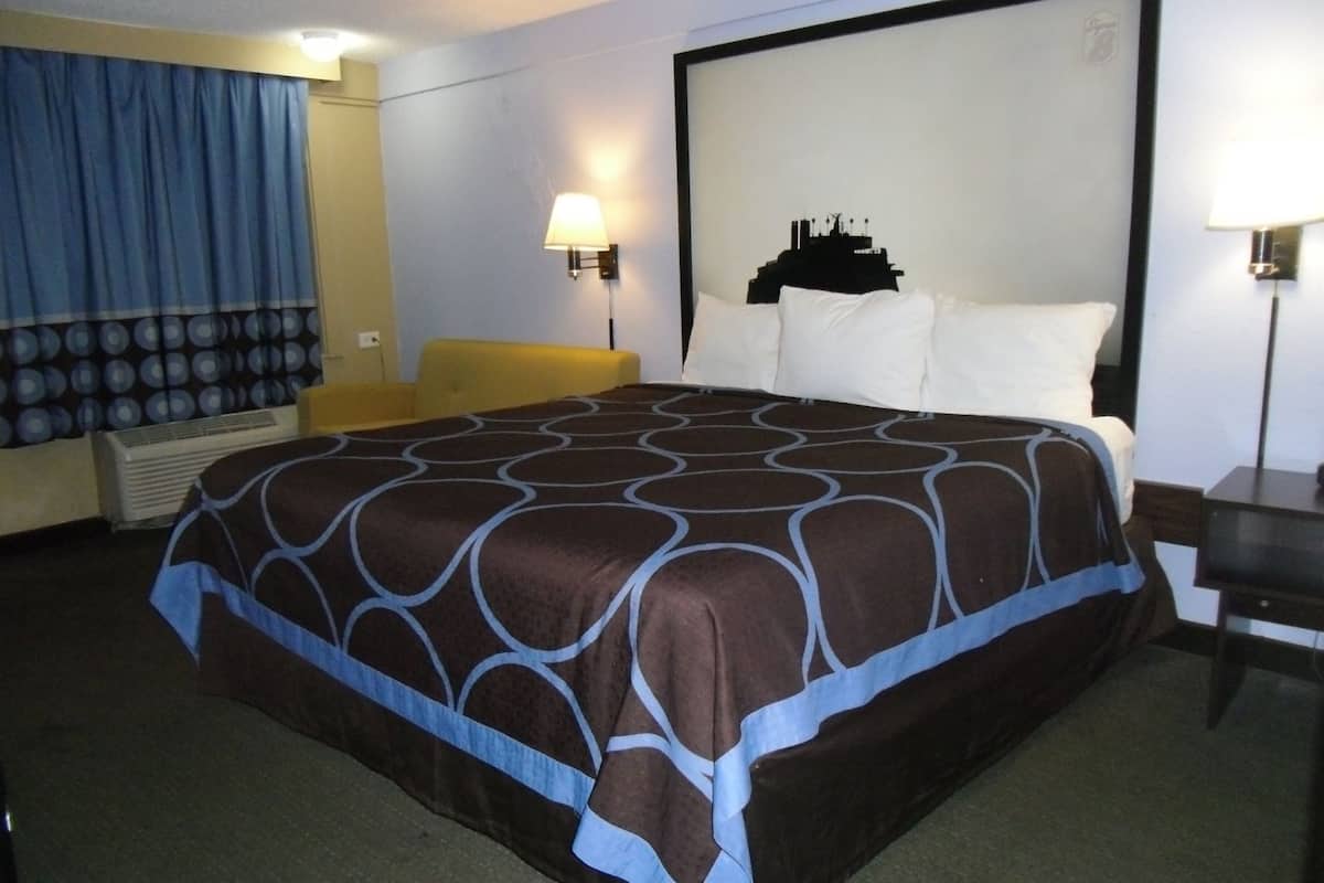 Desk, laptop workspace, blackout curtains, iron/ironing board