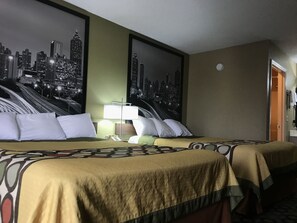 A hotel room with two beds, a cityscape view, a nightstand with a lamp, and a telephone. - Super 8 by Wyndham Ashburn (Ashburn)