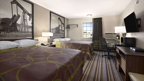 A hotel room with two beds, a desk, a chair, a television, and a window with curtains. - Super 8 by Wyndham Ardmore (Ardmore)