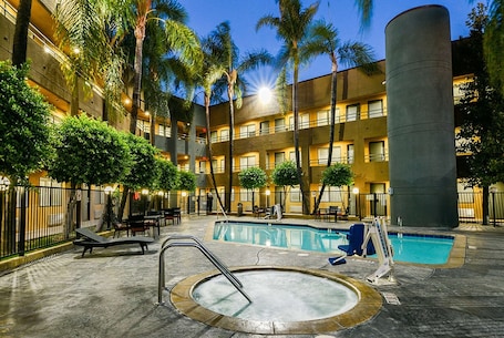 Outdoor pool. Travelodge by Wyndham Commerce Los Angeles Area