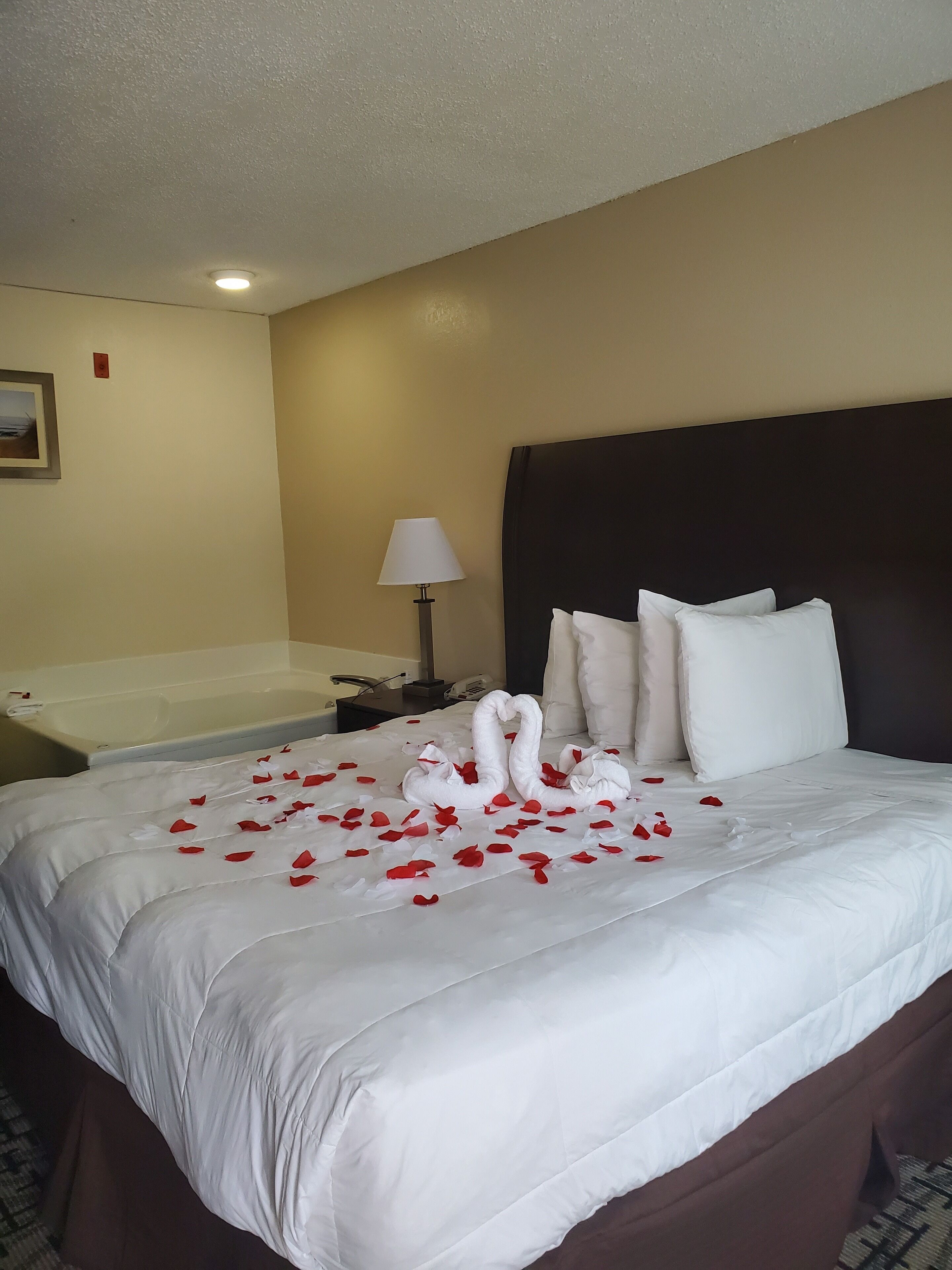 Suite, 1 King Bed, Non Smoking, Jetted Tub | Desk, laptop workspace, blackout curtains, iron/ironing board