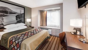 A hotel room with a bed, a desk, a chair, a TV, a window with curtains, and a large framed picture on the wall. - Super 8 by Wyndham Schenectady/Albany Area (Schenectady)