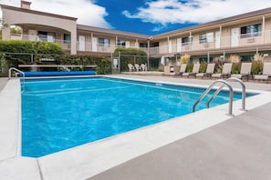 Seasonal outdoor pool, open 10:00 AM to 10:00 PM, pool umbrellas