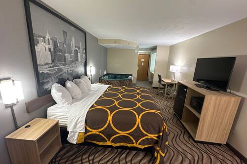 Suite, 1 King Bed, Non Smoking, Jetted Tub | Desk, iron/ironing board, free cots/infant beds, rollaway beds