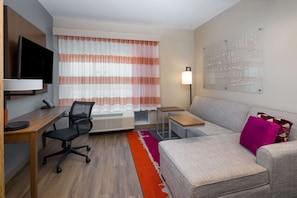 Desk, laptop workspace, blackout drapes, iron/ironing board