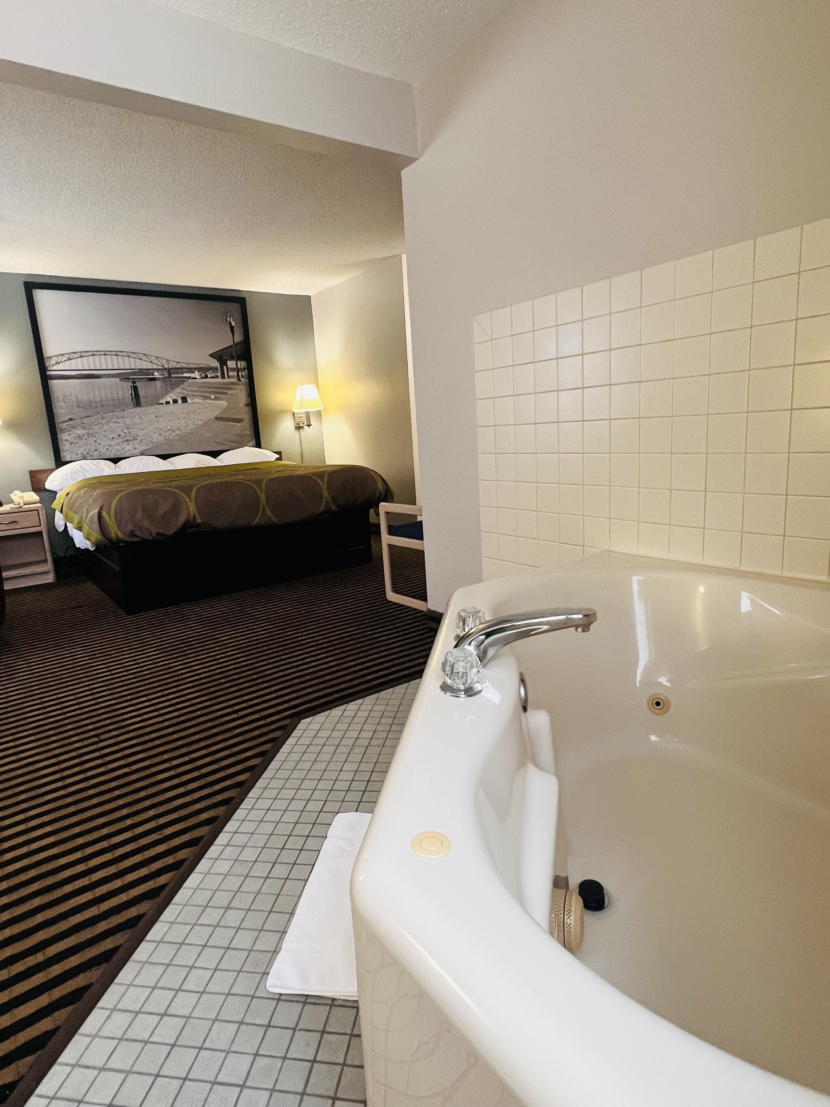 Deluxe Studio Suite, 1 King Bed, Non Smoking | Desk, blackout drapes, iron/ironing board, cribs/infant beds