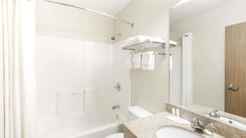 Designer toiletries, hair dryer, towels