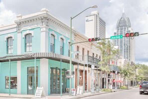 A street view with buildings, a traffic light, and a sign for Joachim St. - Super 8 by Wyndham Mobile (Mobile)