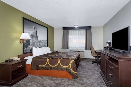 In-room safe, desk, laptop workspace, blackout curtains. Super 8 by Wyndham Amarillo Central TX