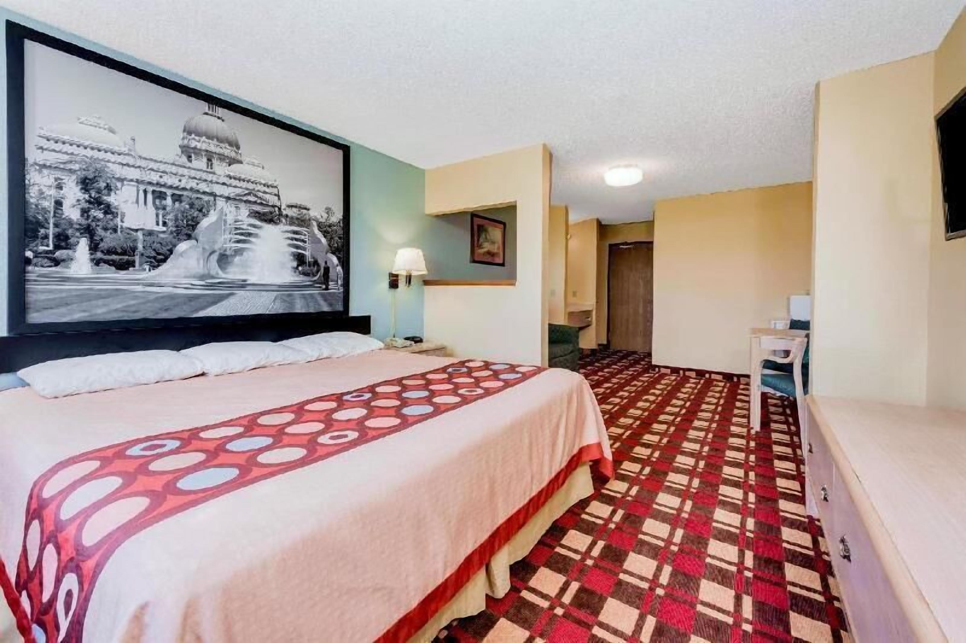 Desk, laptop workspace, blackout drapes, cribs/infant beds